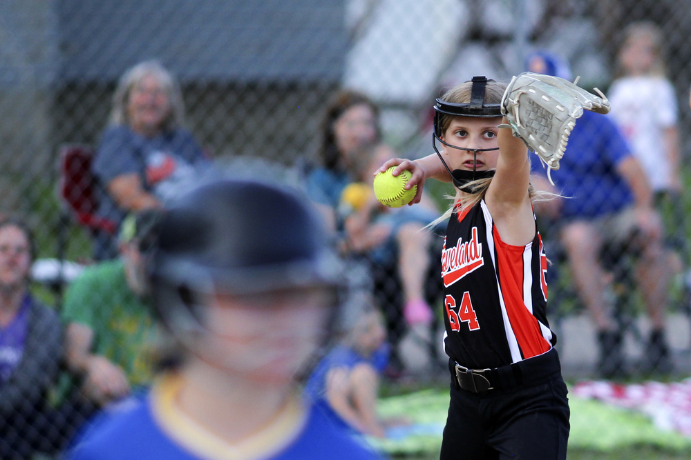 Girl throwing sofball
