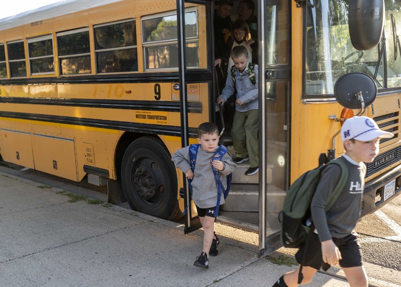 Boys by school bus