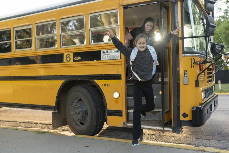 girl by bus