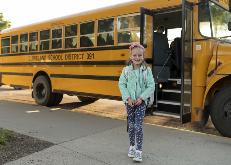 girl by bus