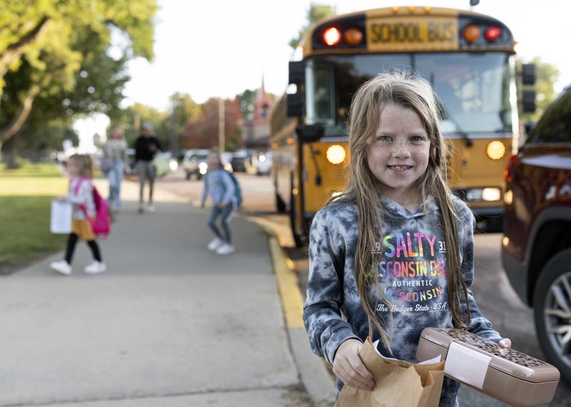 girl carrying bag