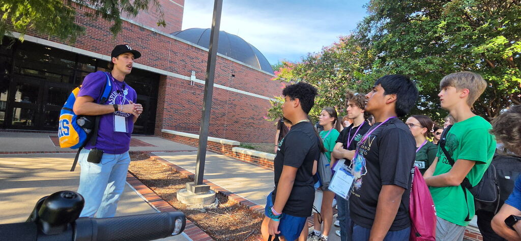 Students listening to a tour guide at Tarleton