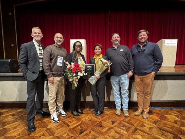 Carol Worley receiving the Raleigh Dingman Award