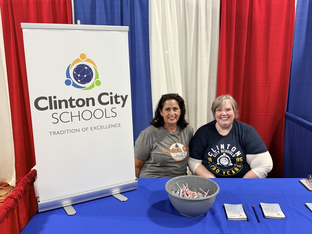 staff members working the fair booth