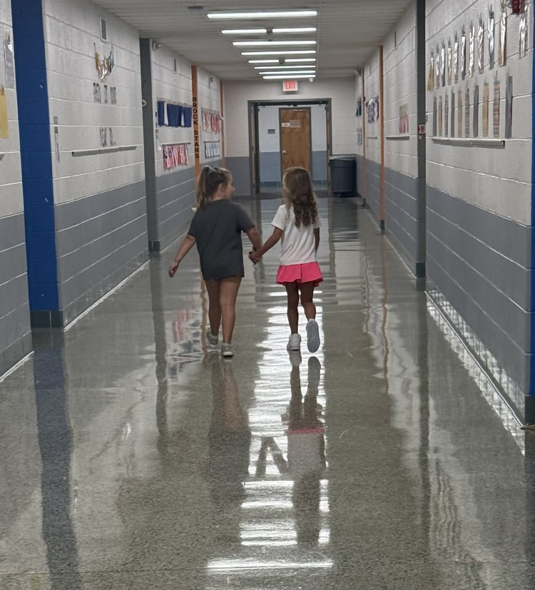 2 kids walking down the hall