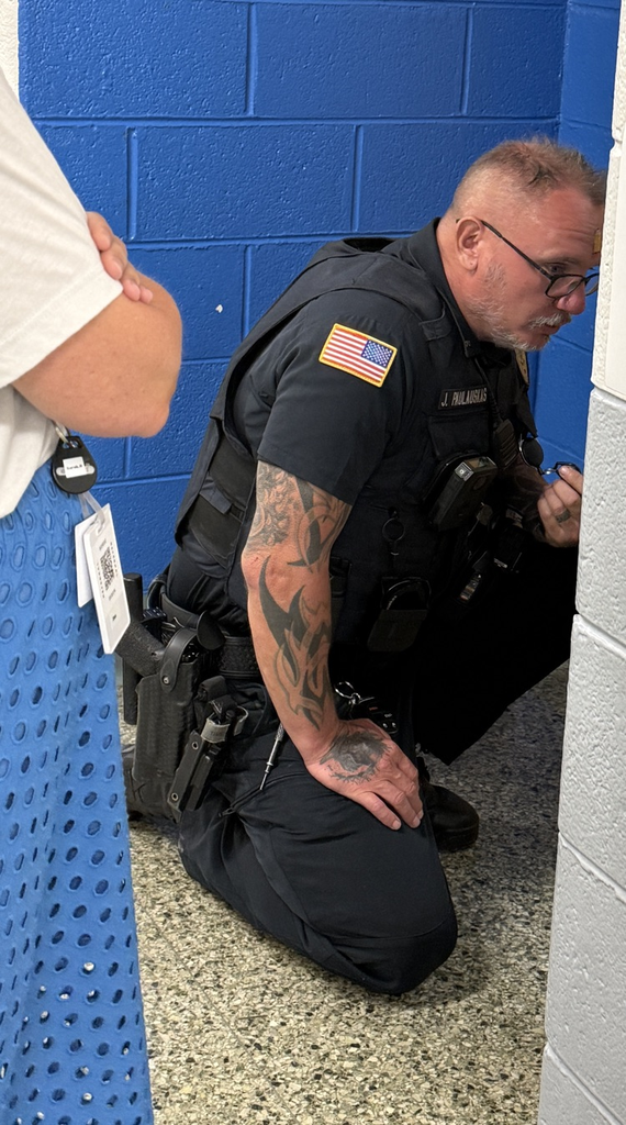 SRO assisting a child who is sad.