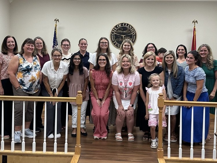CES new employees at school board meeting