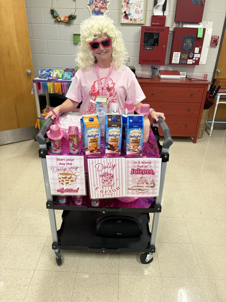 Mrs. Breeden handing out Dolly Carton snacks to staff 