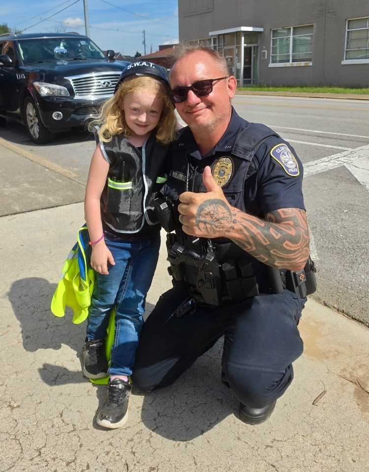 SRO with student dressed up a policewoman swat team member