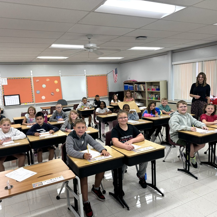 students smiling in classroom first day