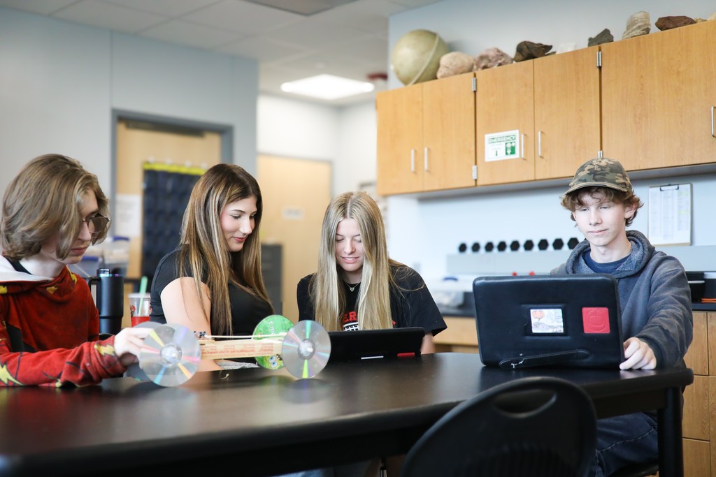 clinton high school students working together at table