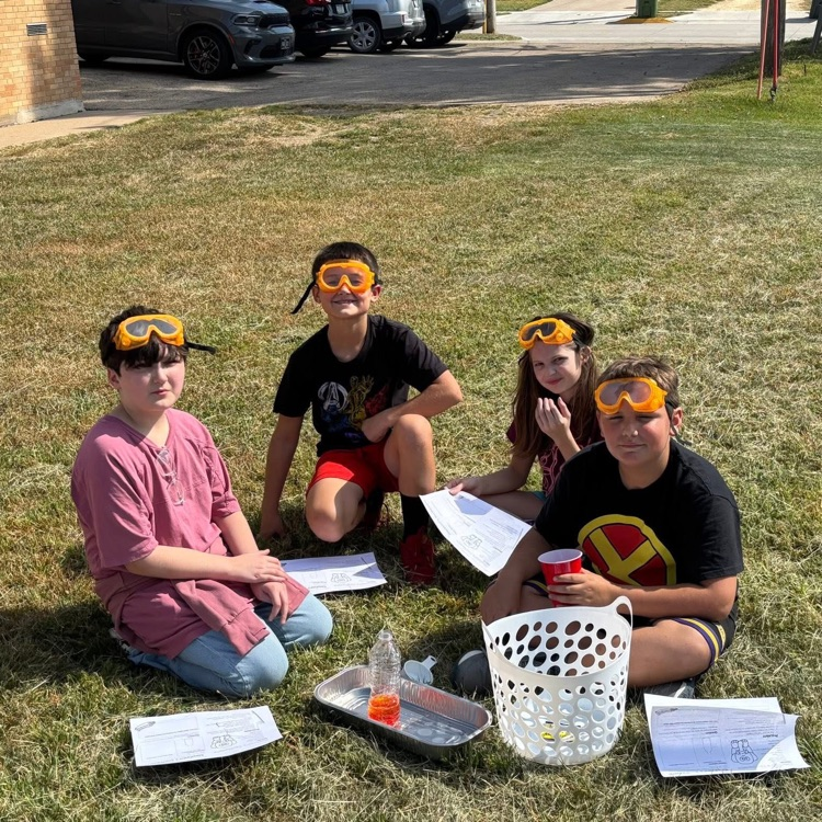 students learning about chemical changes outside 