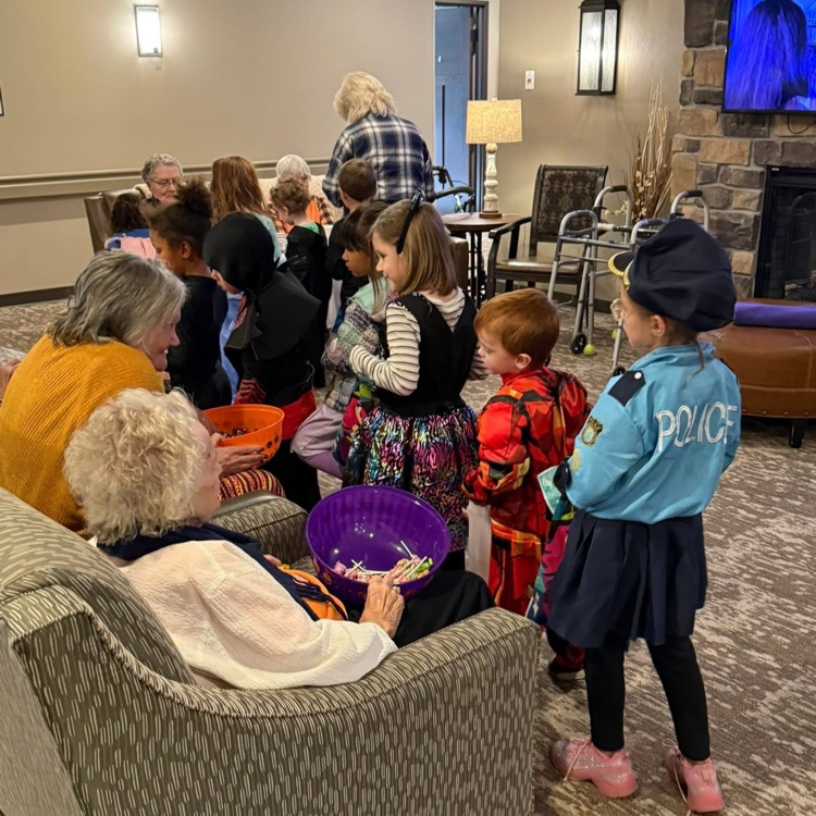 students trick or treat at nursing home 