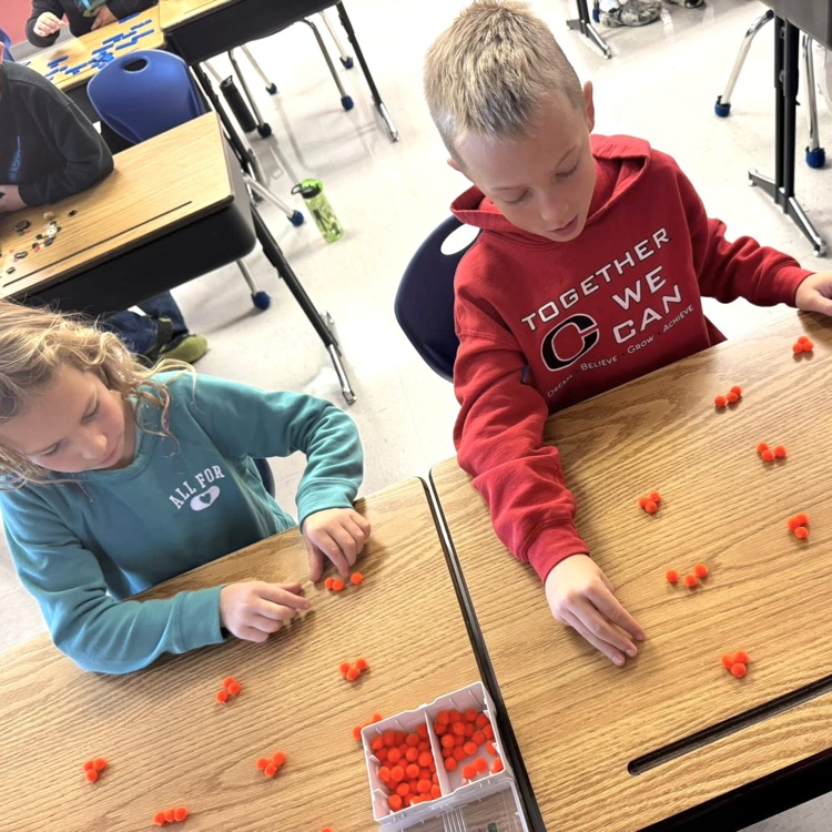 3rd graders work together as they begin multiplication 