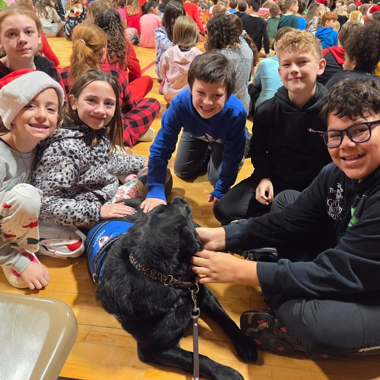 students pose with dog