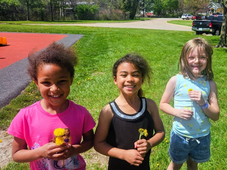 students with flowers