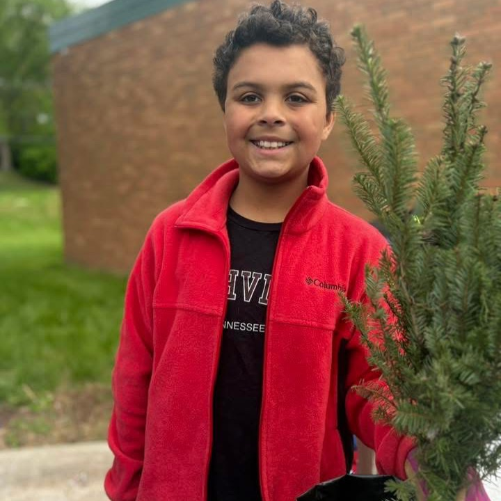 student with his tree