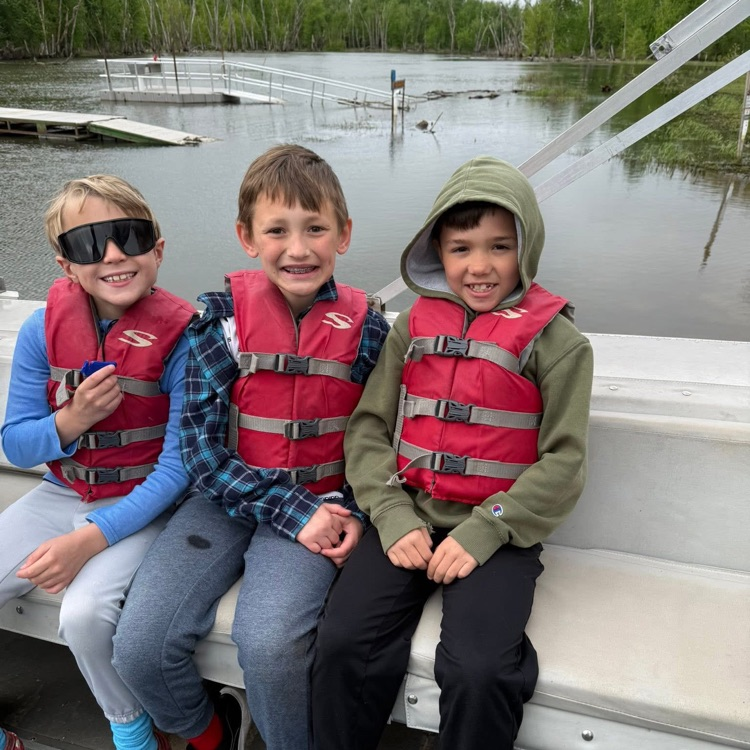 students on boat at rock creek