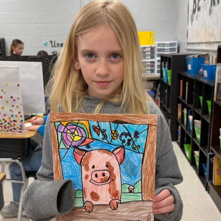 student with pig drawing