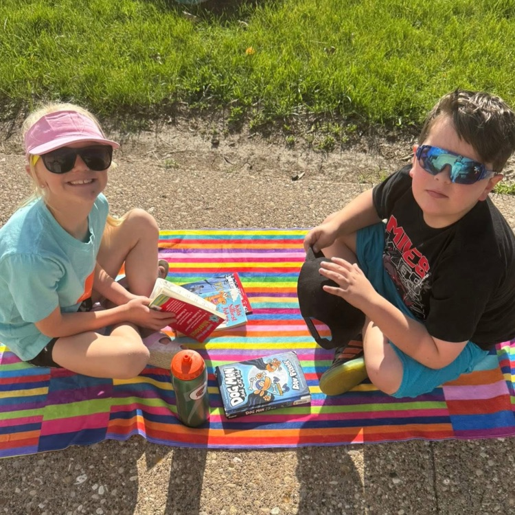 students reading outside