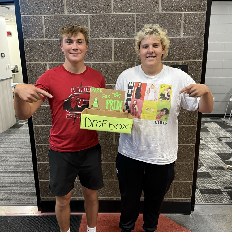 2 students with a box