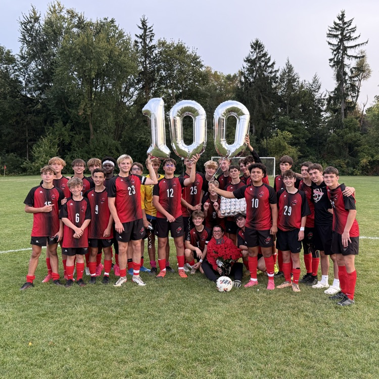 soccer team with 100 balloon