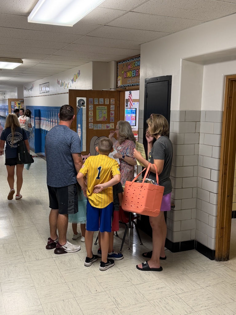 Parents meeting their teacher.