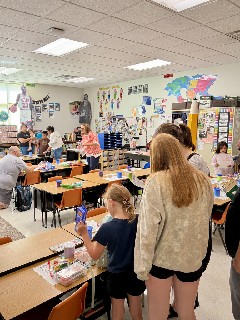 Student and parents unpacking their school supplies