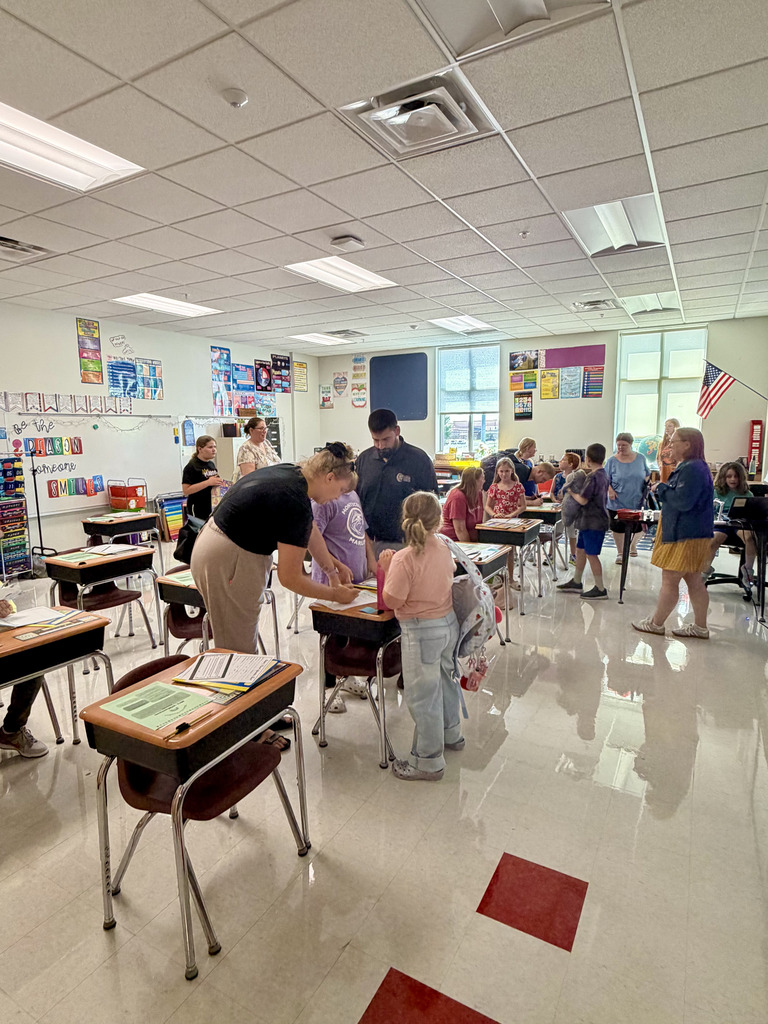 Parents and student unpacking bag
