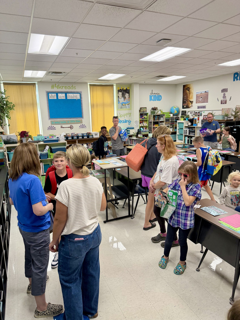Mrs Kessinger talking to a parent and student
