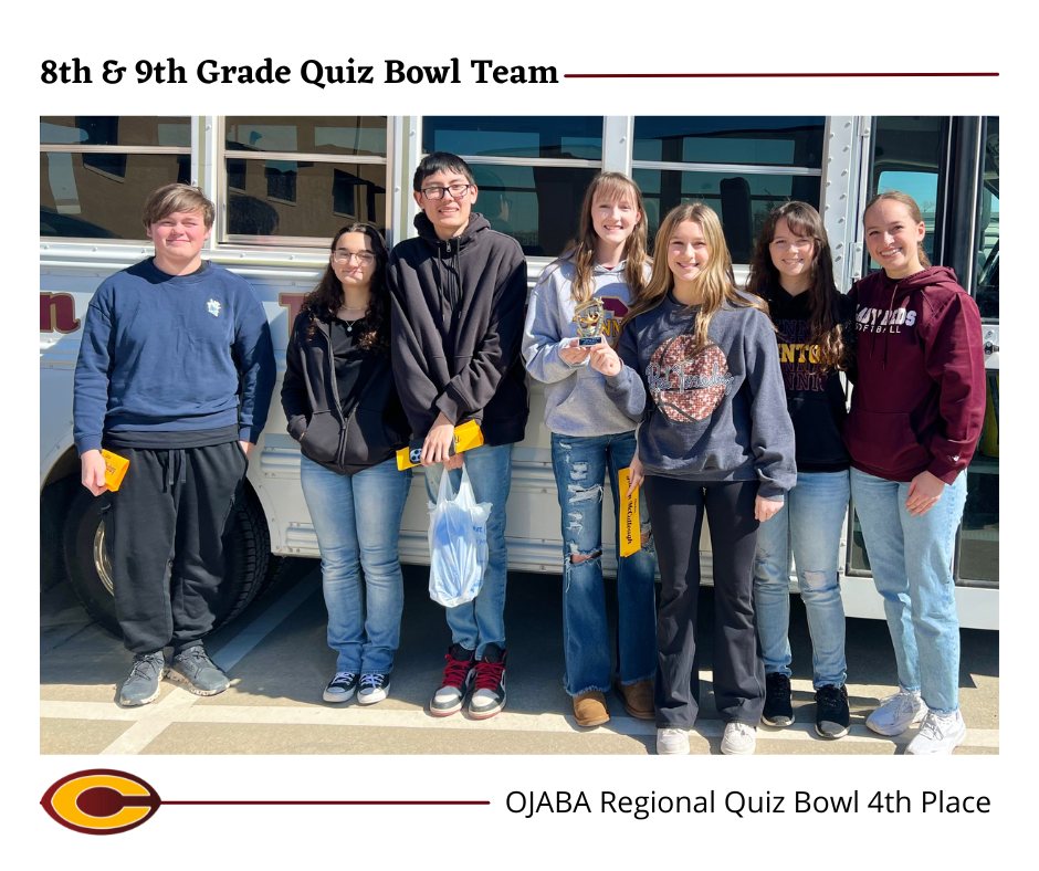 8th & 9th grade quiz bowl team standing in front of bus