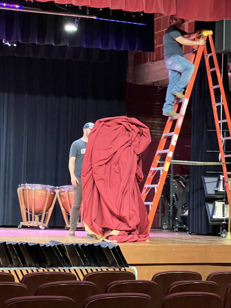 CMS auditorium curtain being taken down