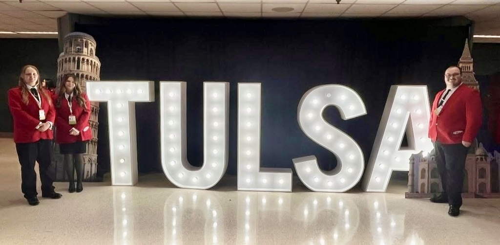 Top 3 placers with lighted Tulsa sign