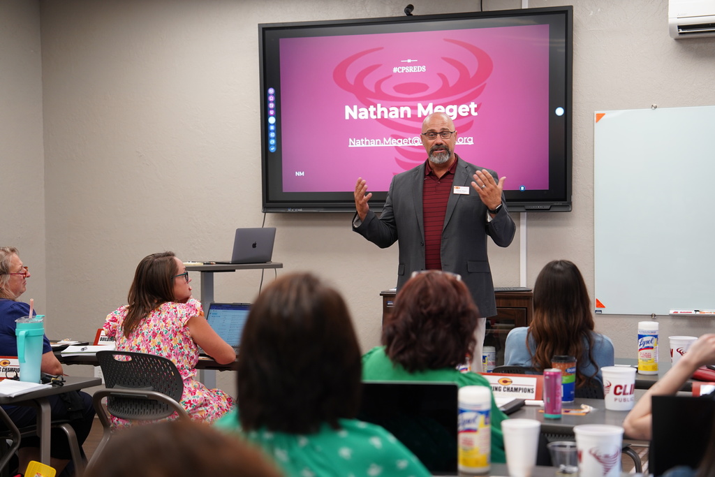 Mr. Meget welcoming new staff to inservice