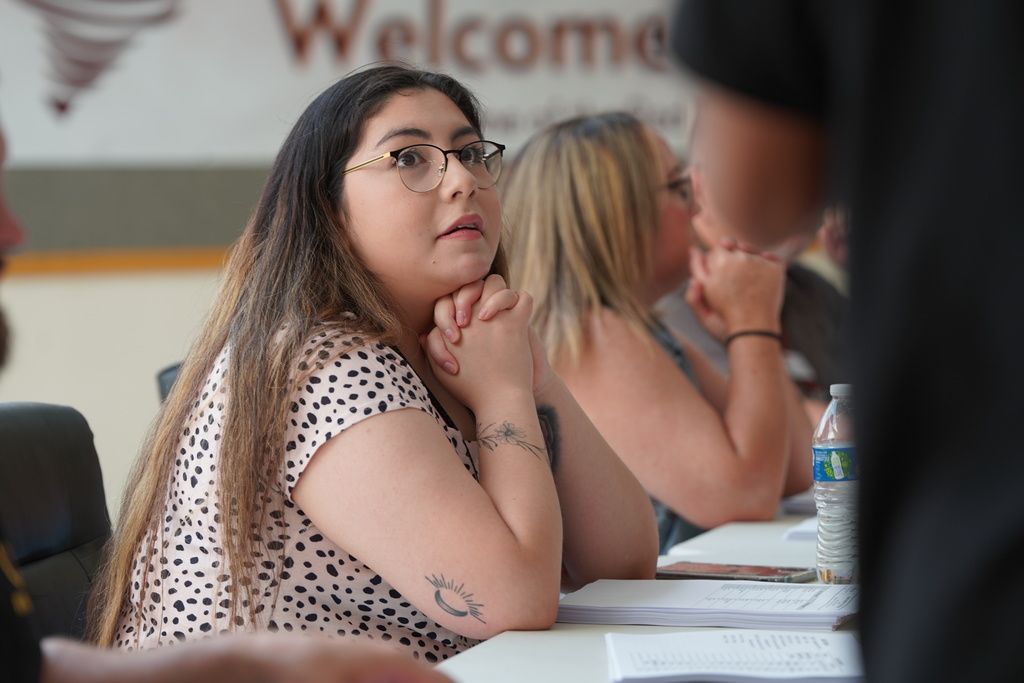 Staff helping students