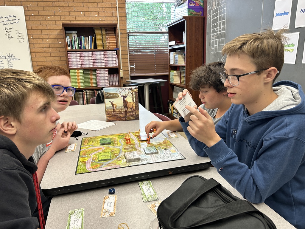 Outdoor Education students playing a board game.