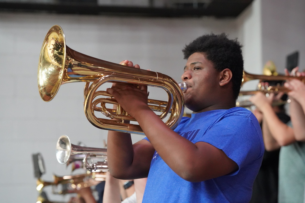 Band student playing horn at the pep assembly