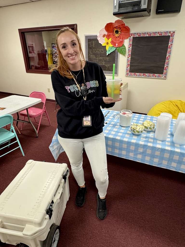 Mrs. Palmer holding a lemonade.