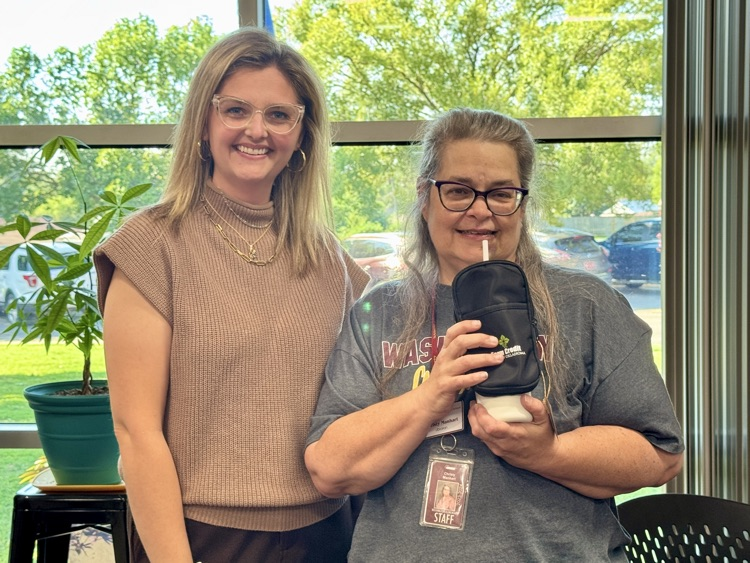 Mrs. Manhart receiving an award from Farm Credit.