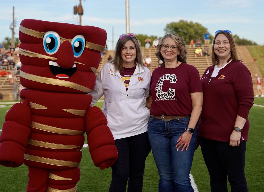 Educator of the Game Letitia Arney  with Tony Tornado, CHS Principal Michelle Sorter and Assistant Superintendent Melissa Knabe