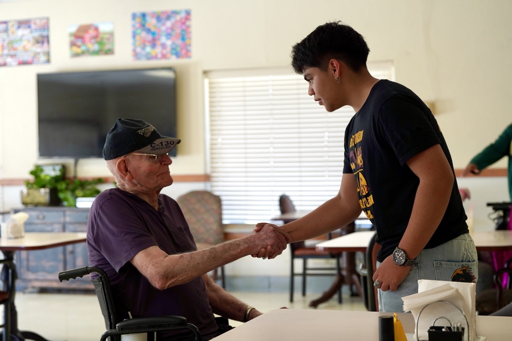 Band students visiting with nursing home residents