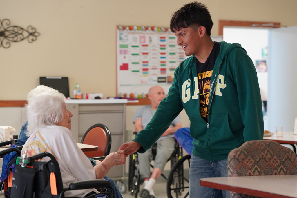 Band students visiting with nursing home residents