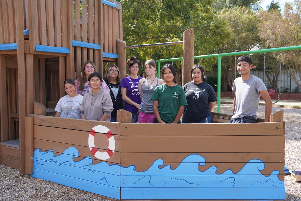 CHS art students painting at Acme Brick Park