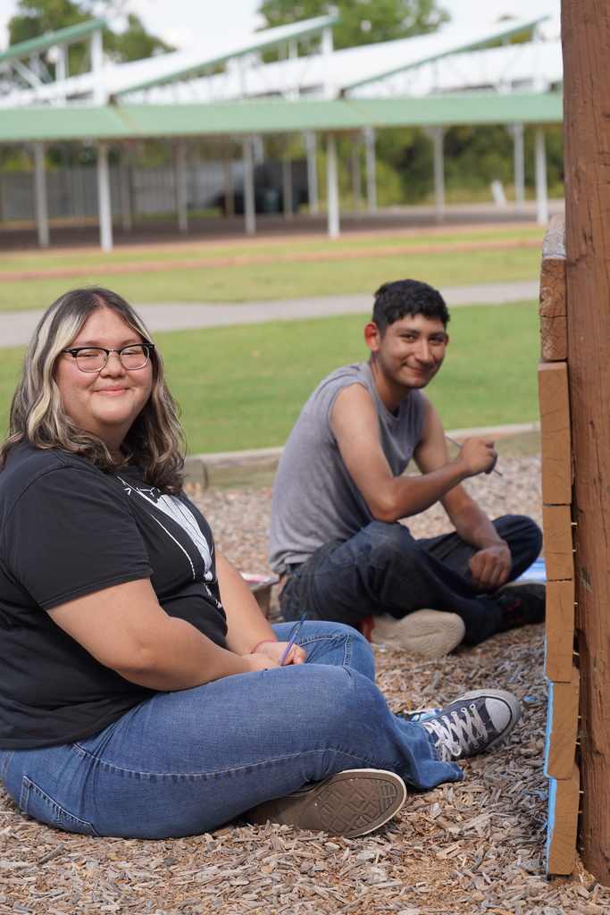 CHS art students painting at Acme Brick Park