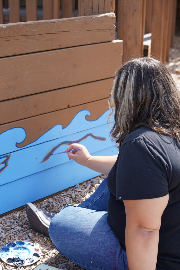 CHS art students painting at Acme Brick Park