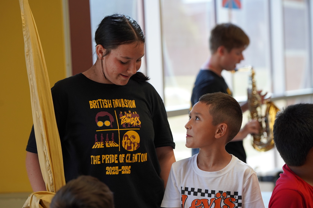 CHS Band student talking to SW student