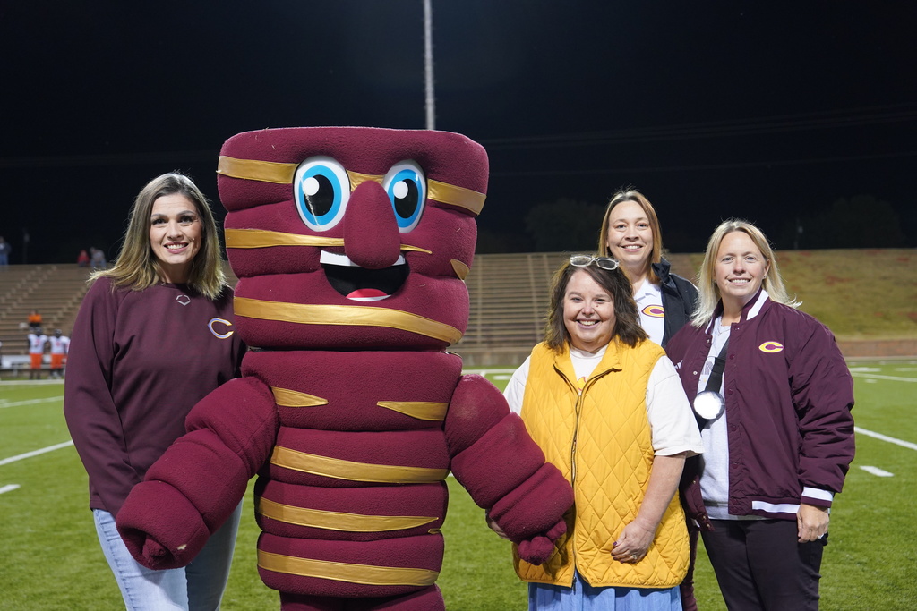 Mrs, Sorter, Tony Tornado, Educator of the Game Kimberly Duerksen, Mrs. Knabe, Mrs. Ray on the football field