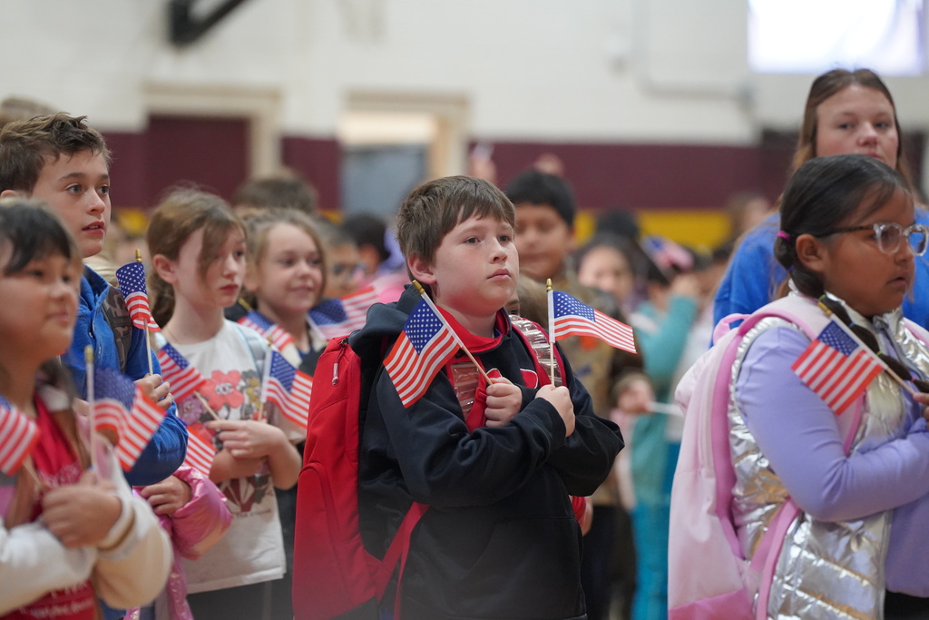 Southwest student holding American flags