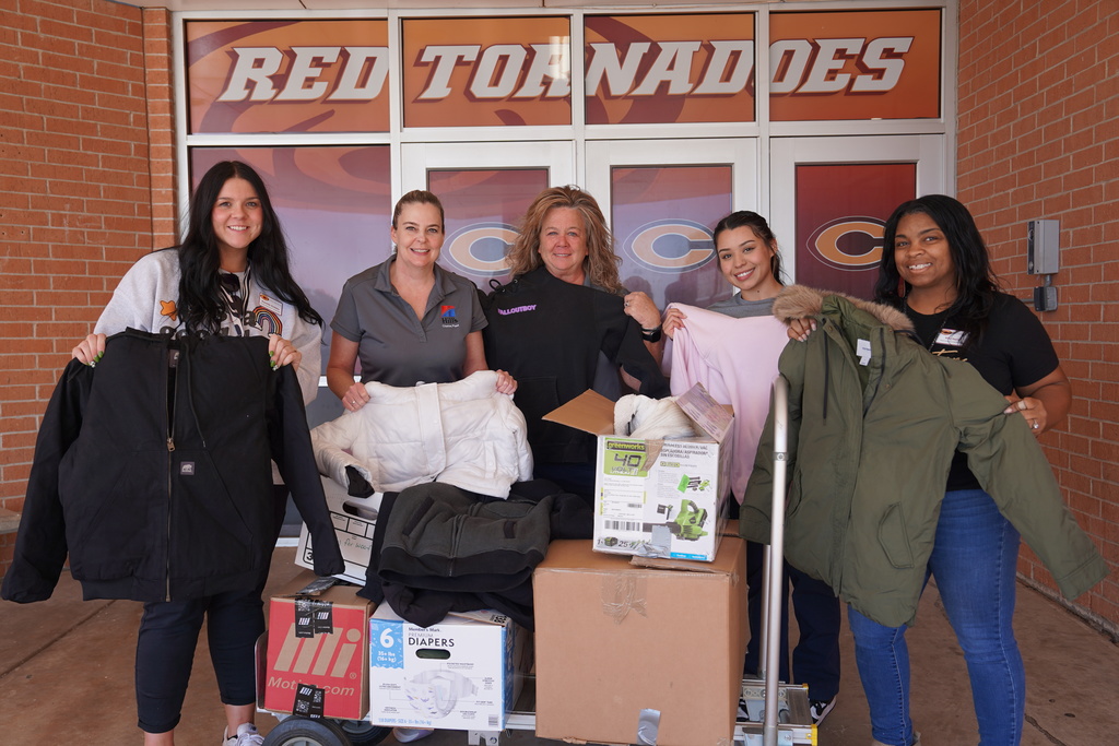 Hill's Pet Nutrition employees dropping off coats to our school resource coordinators