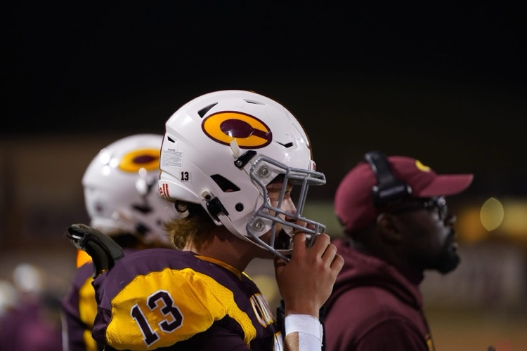 CHS football player on the sideline